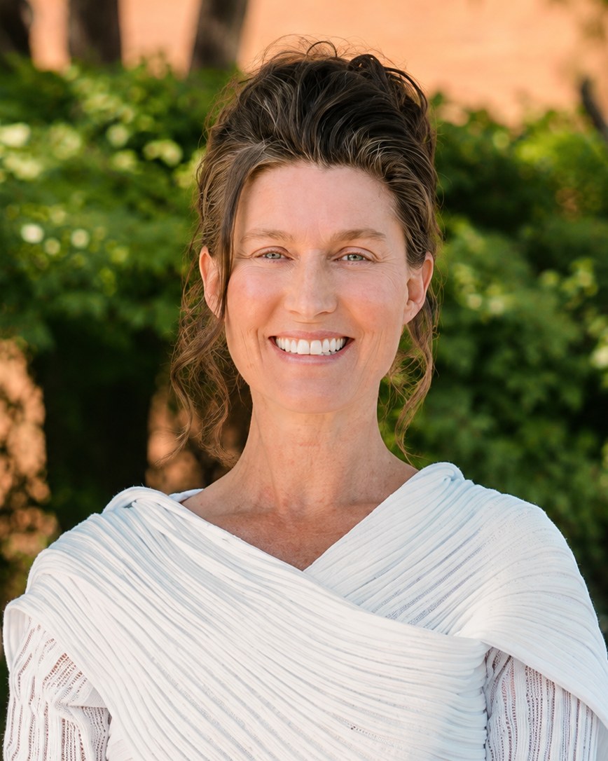 Angela, founder of Errands by Angela, smiling outdoors